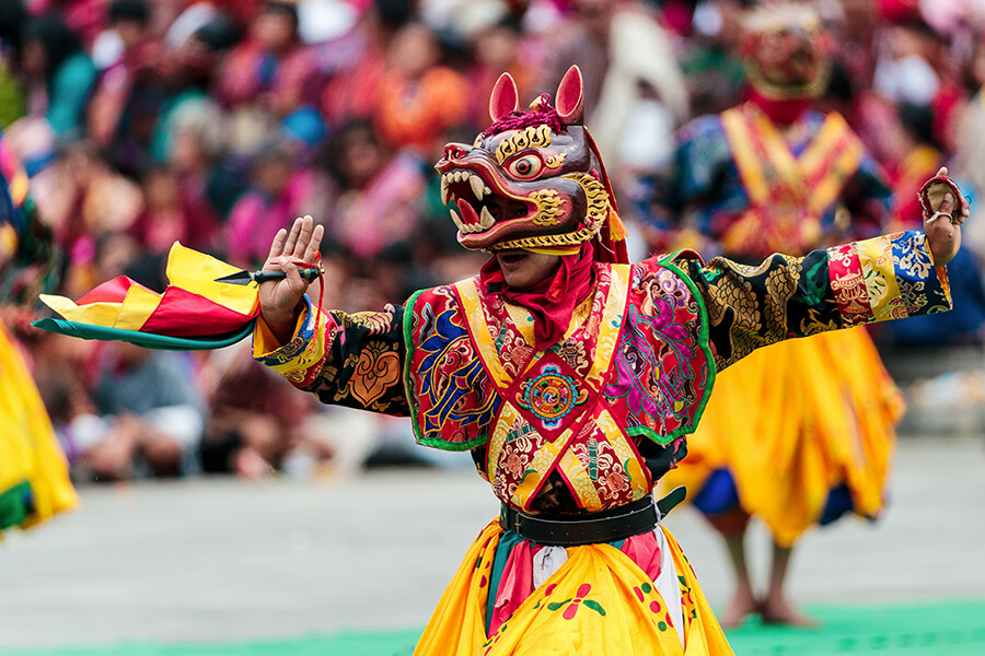 Vibrant traditional dancers in colorful costumes during a festival