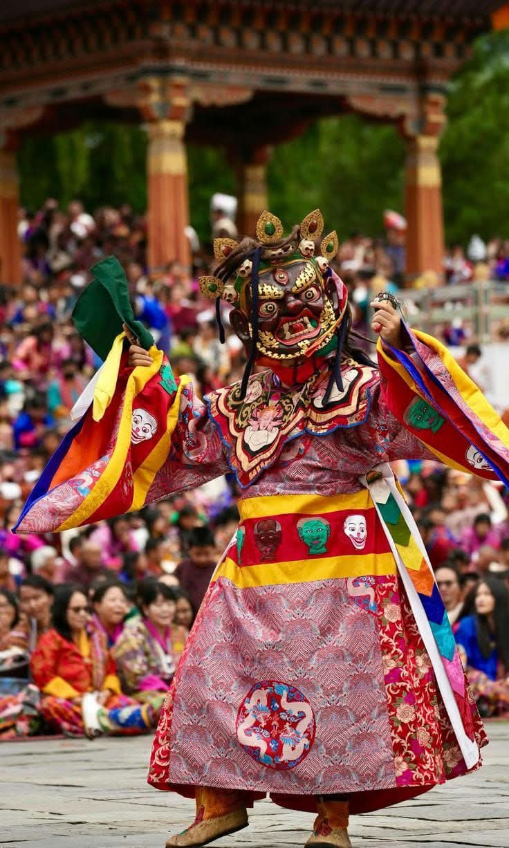 Vibrant traditional dancers in colorful costumes during a festival