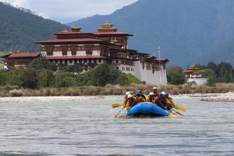 Traditional wooden boat on a calm Bhutanese lake