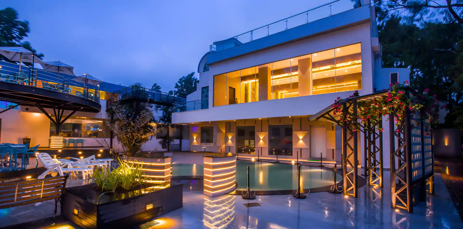 The Zenith Paro exterior at twilight with illuminated glass facade